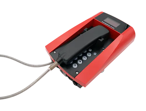 Schwarzes Telefon mit rotem Gehäuse und Metallkabel